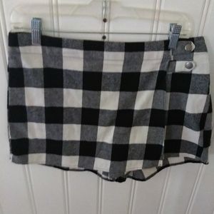 BeBop plaid shorts with skirt overlay.